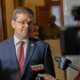 Chad Meredith, Kentucky’s solicitor general, speaks to members of the media after making arguments before the Kentucky Supreme Court at the state Capitol in Frankfort, Kentucky, in 2021.